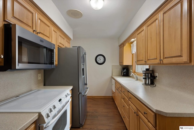 kitchen featuring sink, hardwood / wood-style flooring, and white range with electric cooktop