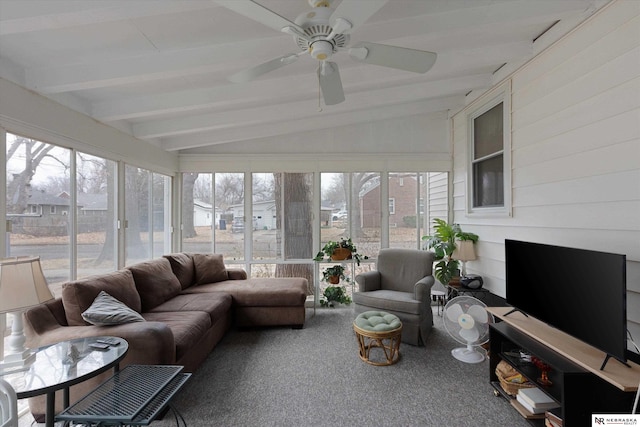 sunroom featuring ceiling fan and vaulted ceiling with beams