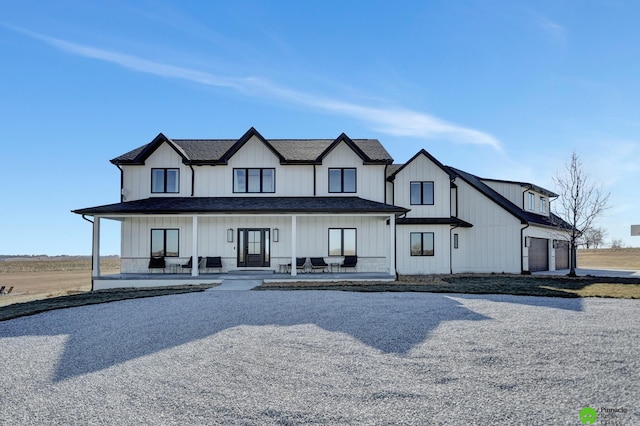 modern inspired farmhouse featuring a garage and covered porch