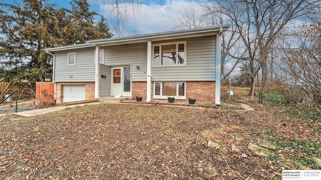 bi-level home featuring a garage