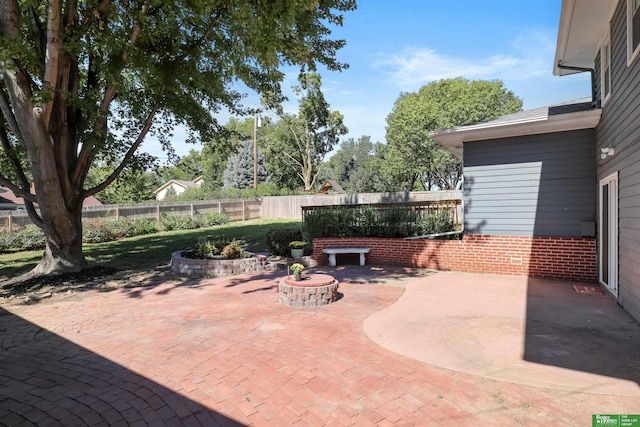 view of patio / terrace with an outdoor fire pit