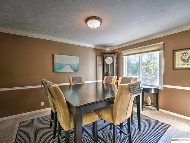 dining room featuring ornamental molding, a textured ceiling, and carpet flooring