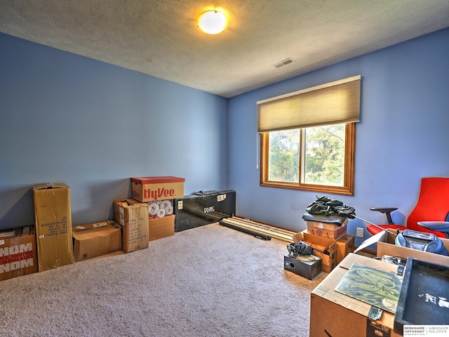 interior space featuring a textured ceiling