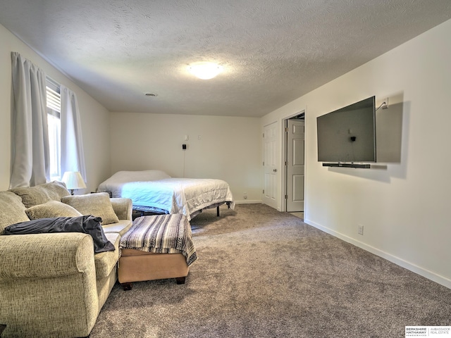 carpeted bedroom featuring a textured ceiling