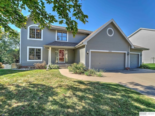 view of front facade featuring a garage and a front lawn