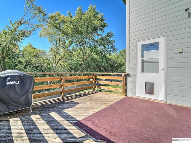 wooden deck with grilling area