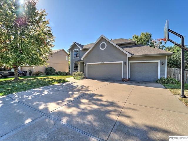 front of property featuring a garage and a front yard