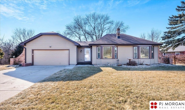 ranch-style home featuring a garage and a front lawn