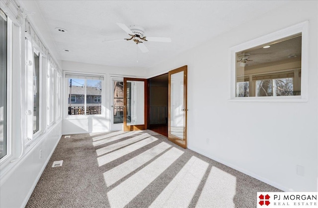 interior space featuring plenty of natural light and ceiling fan