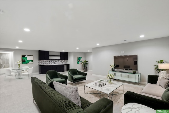 living room featuring recessed lighting and baseboards