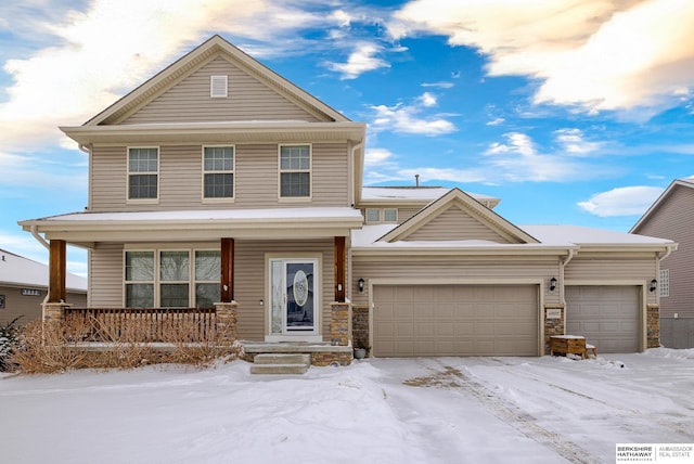 view of front facade with a garage and a porch