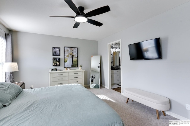 carpeted bedroom featuring ceiling fan and ensuite bathroom