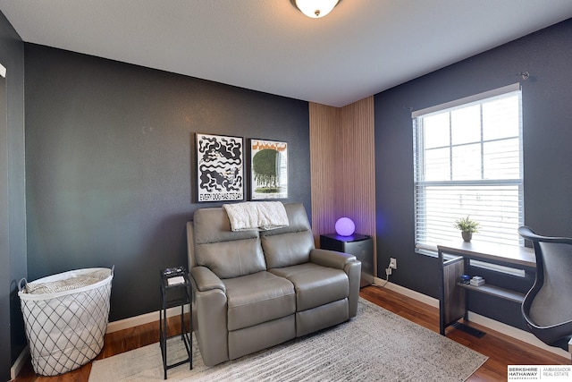 interior space with hardwood / wood-style floors and plenty of natural light