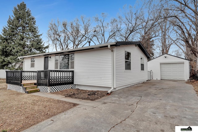 view of front of property featuring an outbuilding and a garage