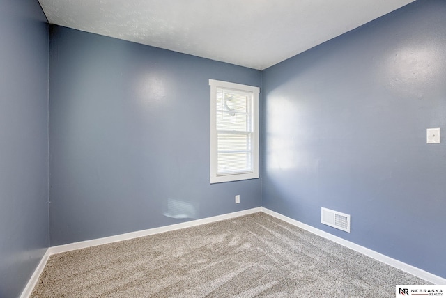 spare room with carpet floors