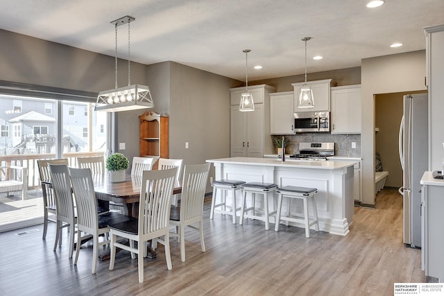 dining room with light hardwood / wood-style flooring