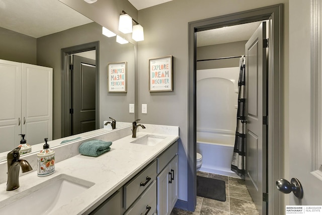 full bathroom featuring vanity,  shower combination, and toilet