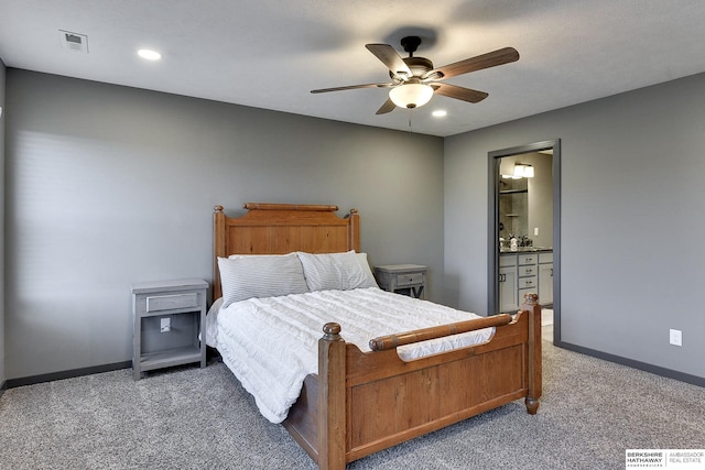 carpeted bedroom with connected bathroom and ceiling fan