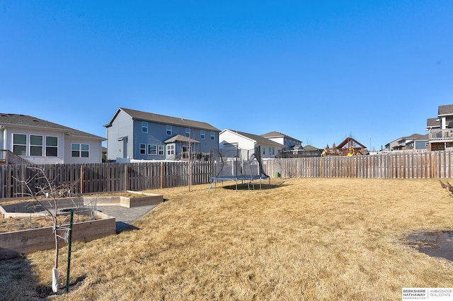 view of yard featuring a trampoline