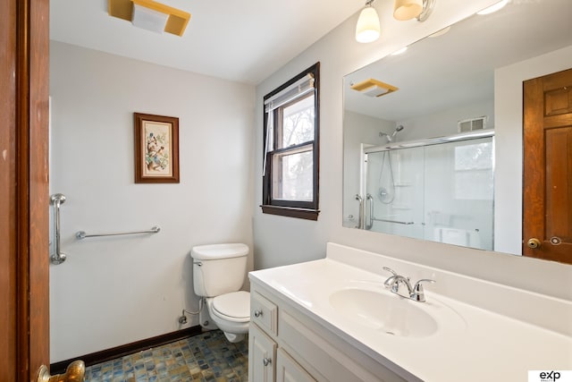 bathroom featuring walk in shower, vanity, and toilet