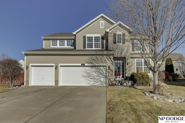 front of property featuring a garage and a front lawn