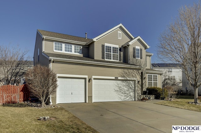 view of front of home with a garage and a front yard