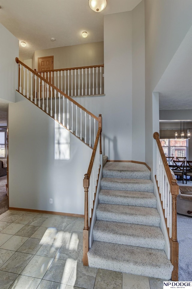 staircase with a high ceiling