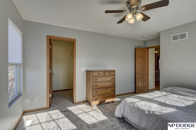 bedroom featuring ceiling fan and light carpet