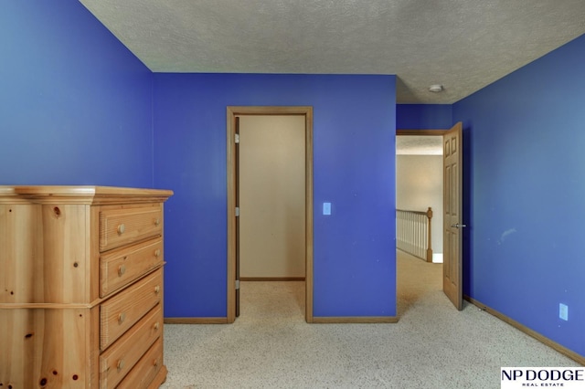 unfurnished bedroom featuring a textured ceiling