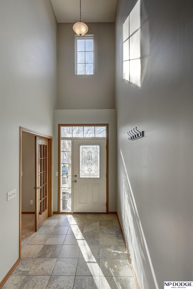 entrance foyer with a towering ceiling