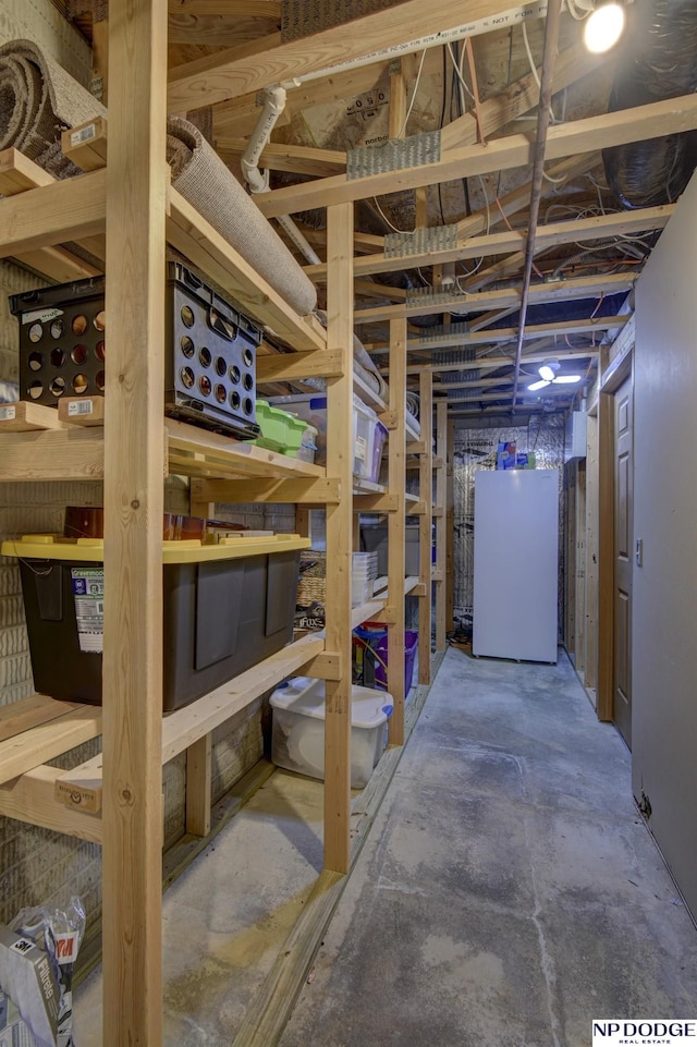 basement featuring refrigerator