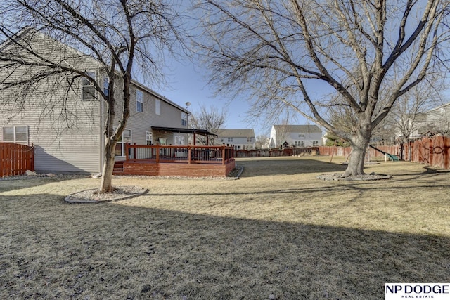 view of yard featuring a playground and a deck