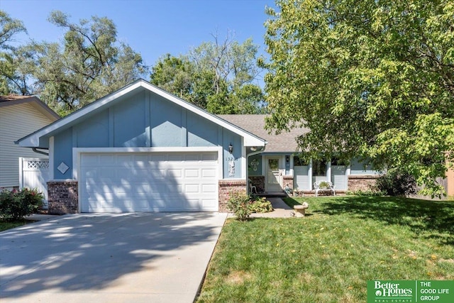 view of front of home with a garage and a front yard