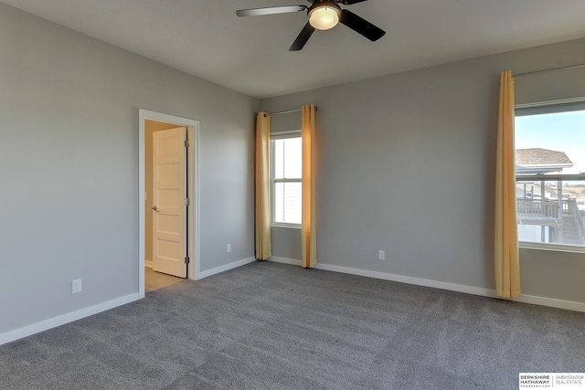 empty room featuring light carpet and ceiling fan