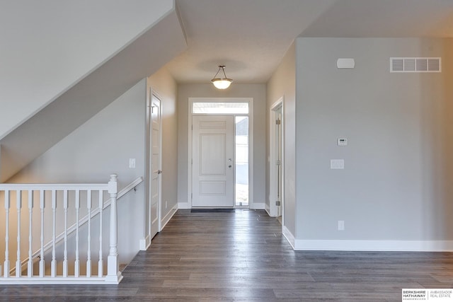 entryway with dark wood-type flooring