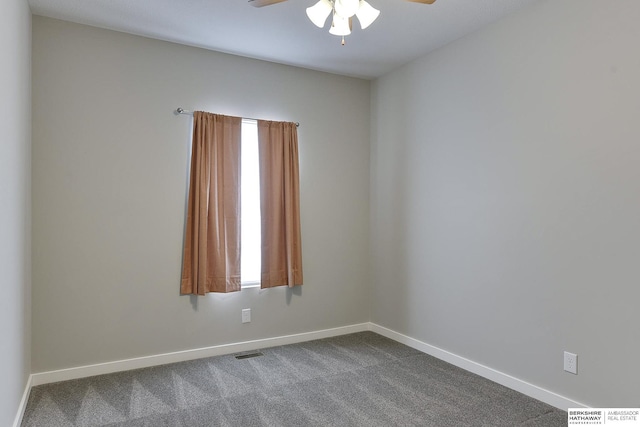 carpeted spare room with ceiling fan