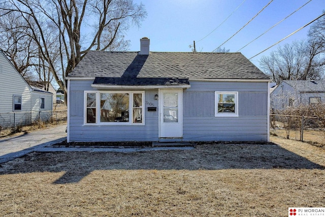 bungalow with a front yard