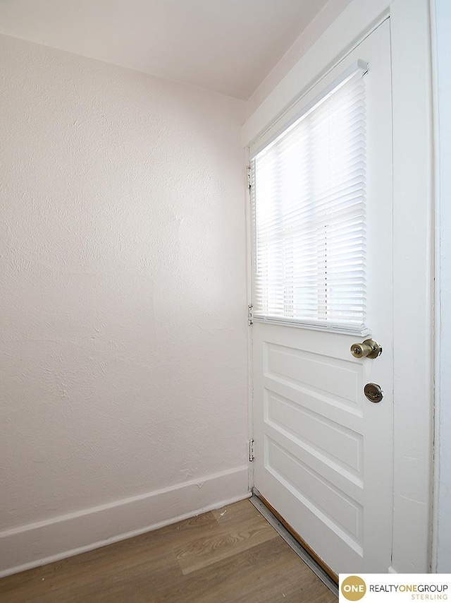 doorway featuring hardwood / wood-style flooring