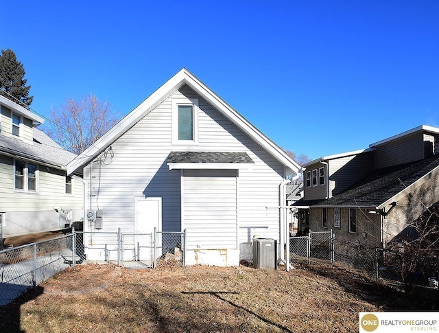 back of property featuring central AC unit