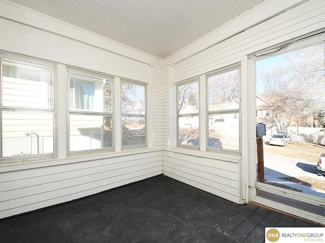 unfurnished sunroom featuring plenty of natural light