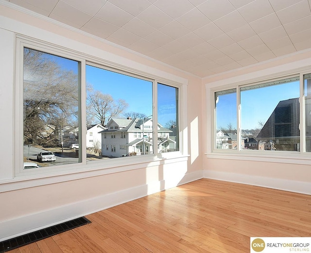 unfurnished sunroom with a wealth of natural light