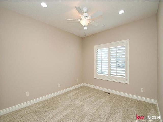 unfurnished room featuring carpet and ceiling fan