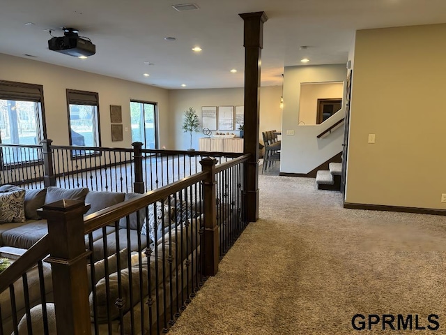 hallway with carpet floors