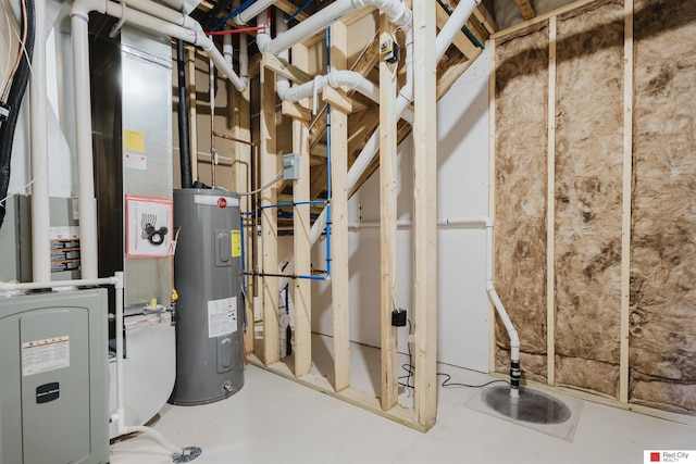 utility room with heating unit and water heater