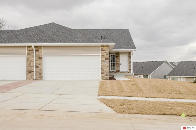 view of front of property with a garage