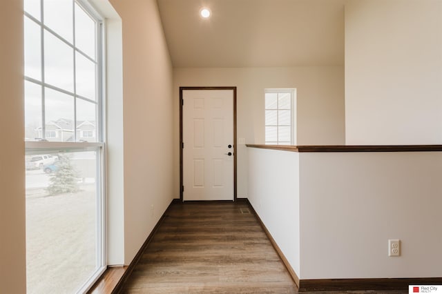 hall with dark wood-type flooring