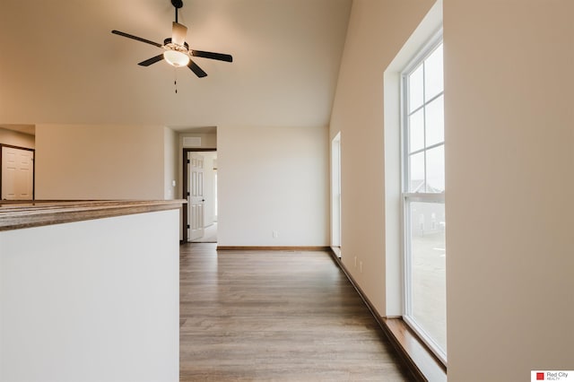 unfurnished living room with hardwood / wood-style floors and ceiling fan