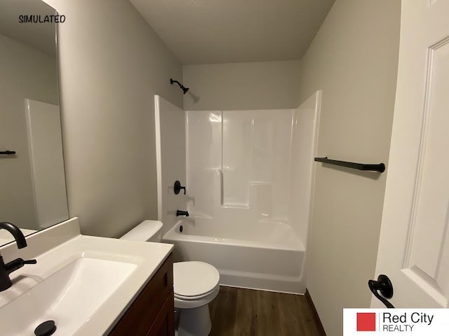 full bathroom featuring vanity, wood-type flooring, tub / shower combination, and toilet