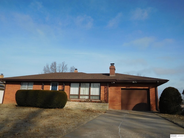 ranch-style house with a carport and a garage