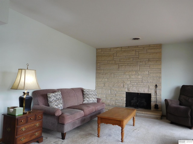 carpeted living room with a fireplace